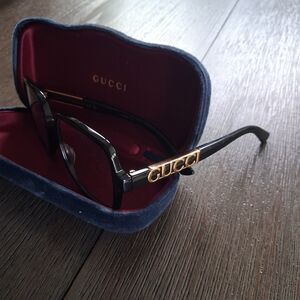 Authentic Gucci black square eyeglass frames featuring elegant gold logo detail